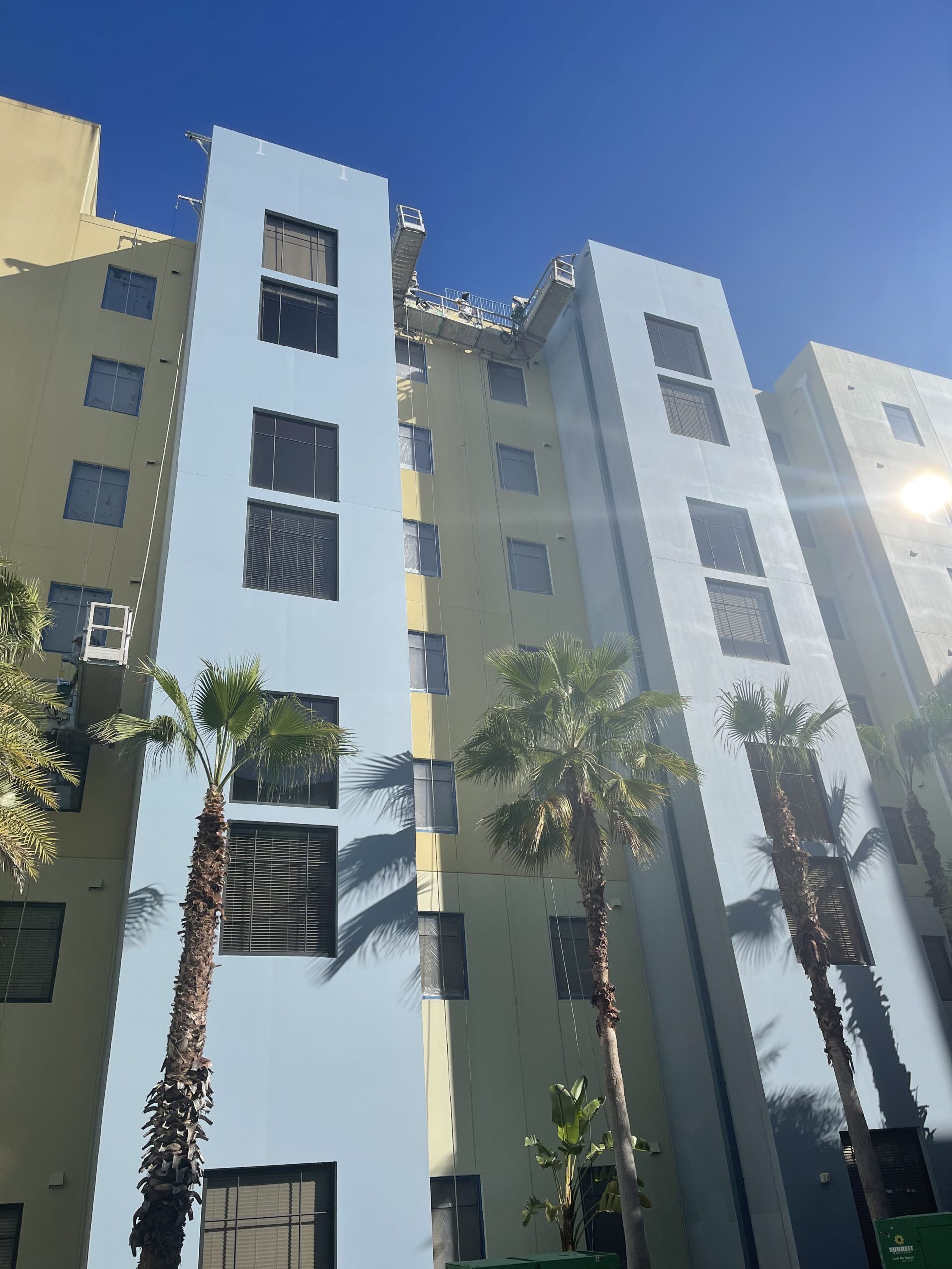 Mid-rise building exterior after commercial painting by Speed Dry