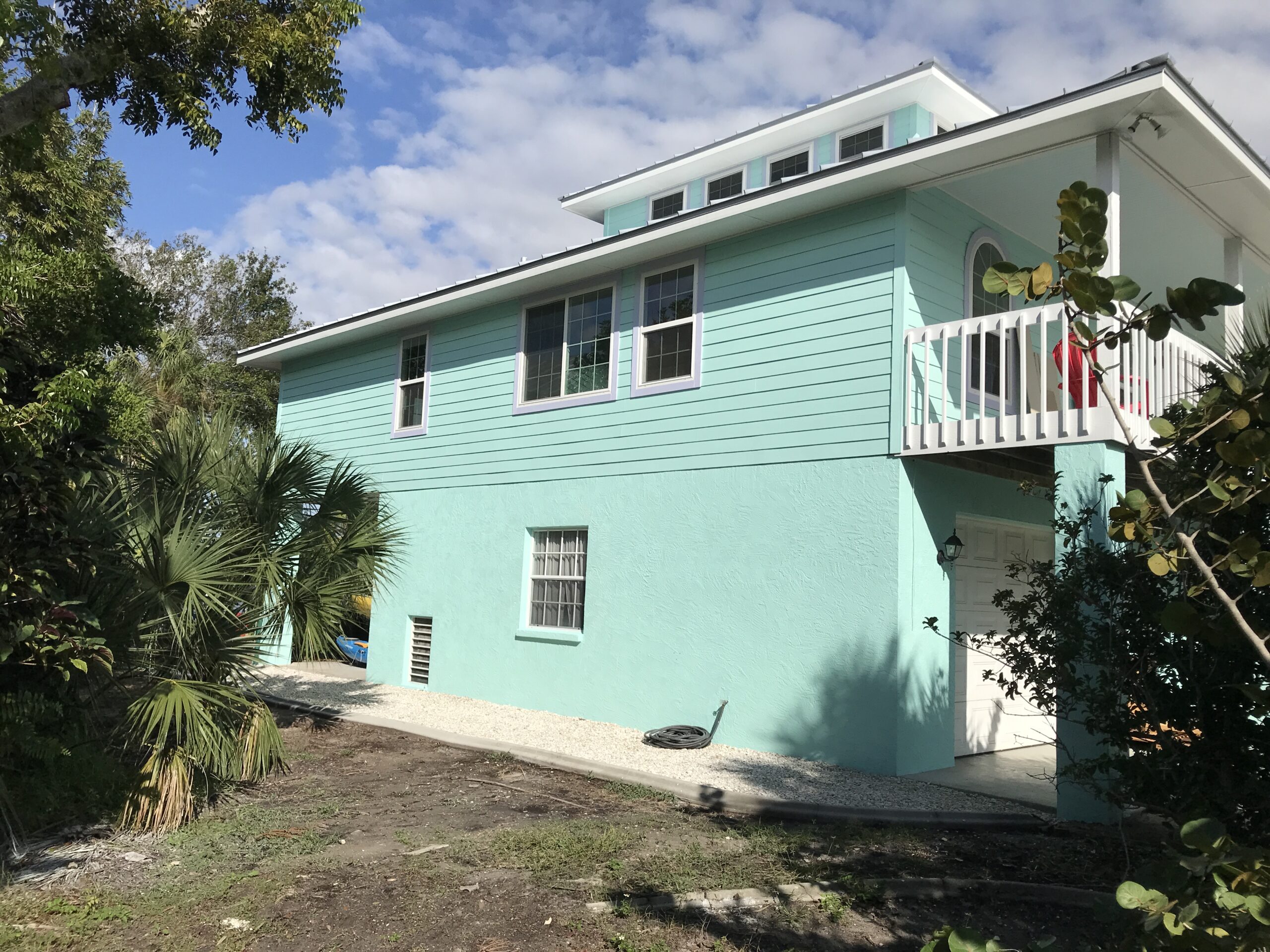Two-story home exterior freshly painted by Speed Dry